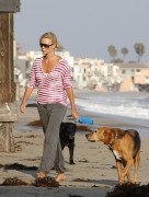 Charlize_Theron_takes_a_stroll_with_her_dogs_on_the_beach_in_Malibu_07